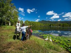couple admiring lakeview, horse ride from Cairns