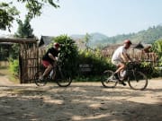 tourists cycling around Lisu hill tribe village