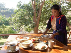 Lisu Lodge woman preparing breakfast