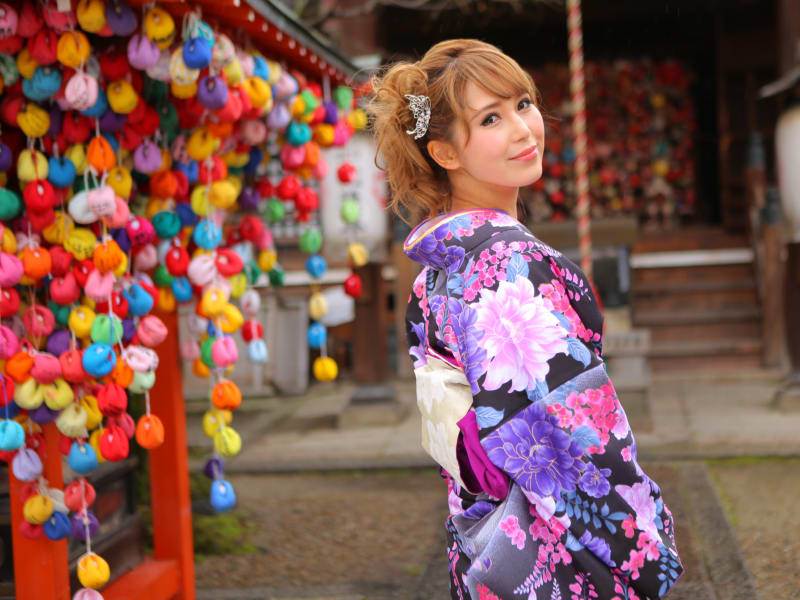 Wearing a bright kimono at a Kyoto temple