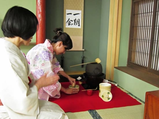 Preparing matcha green tea in a yukata