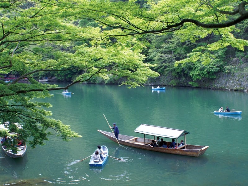 Leisurely cruising downstream on a yakatabune