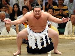 Yokozuna wrestler entering the sumo ring