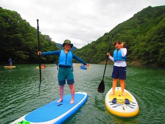 Posing for a picture on a SUP board