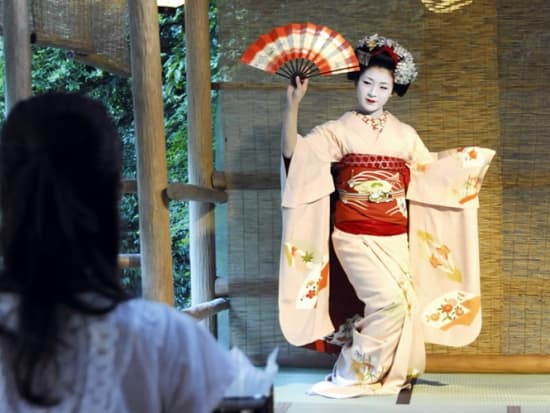A maiko performing classic dance in Kyoto