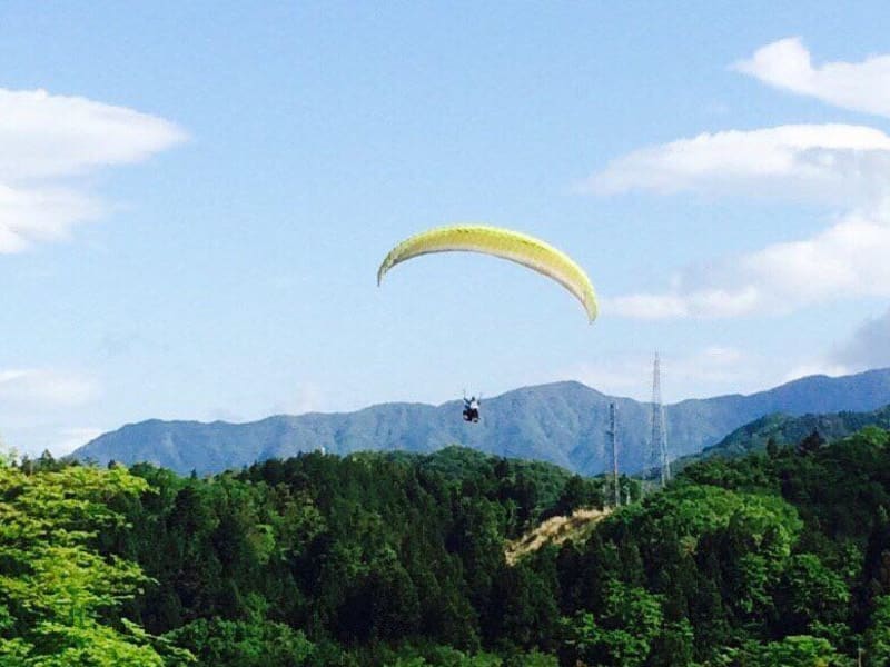 Lifting off over Japan on a paraglider