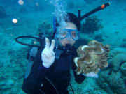 Diver posing with a giant clam