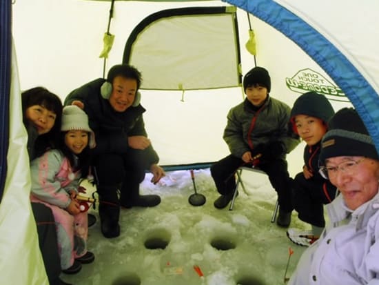Family ice fishing on the Barato River