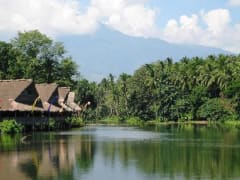 Villa Escudero Resort nipa huts and calm waters