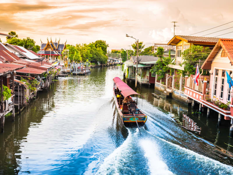 Ride a long-tail boat across the small canals