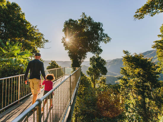 father and child walking at mamu tropical skywalk