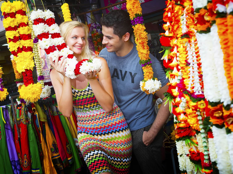 Little India couple posing with flowers