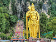 golden statue of lord muruga batu caves entrance