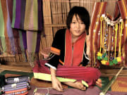 Local villager with traditional handwoven bag