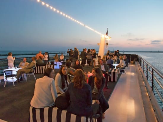 Guests-on-Sundeck-at-Sunset_MdR-Harbor_Gallery