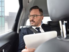 man inside private car airport transfer in india