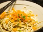 bowl of noodles with vegetable toppings beijing