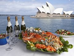 seafood platter and salad with bottles of wine