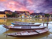 local boats docked in thu bon river in hoi an
