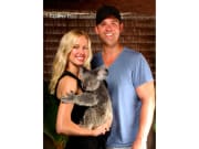 couple posing with koala