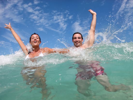 couple swimming at moreton island tangalooma