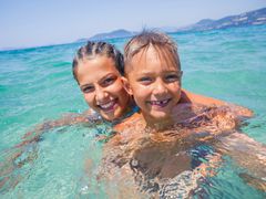 travelers enjoying the beach moreton island