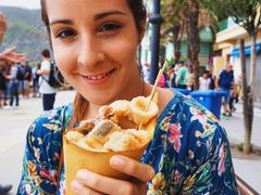 Tourist holding street food in Monterosso
