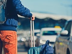 airport passenger waiting for private car