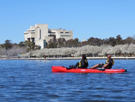 couple on pedal kayak near high court in australia