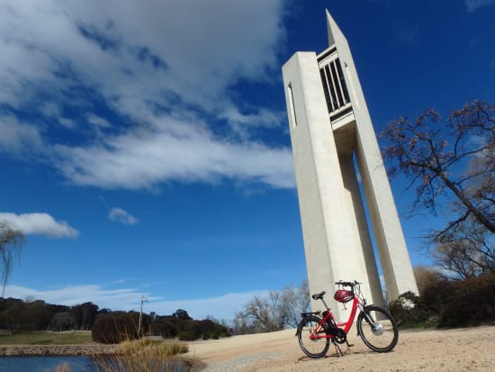 red bike parked in front of national carillon