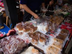 local snacks wrapped in plastic sold at the market