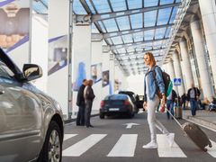 woman crossing pedestrian lane in the airport