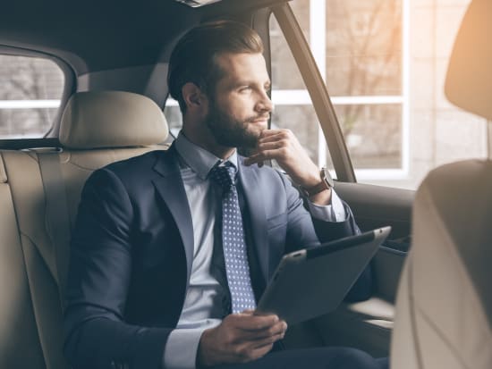 man sitting inside car private airport transfer