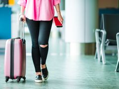 Airport Woman with pink luggage