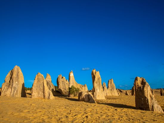 pinnacles desert stone formations under blue sky