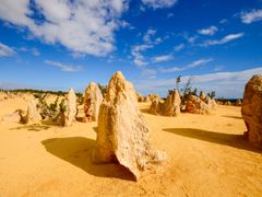 sun shining down limestone formation pinnacles