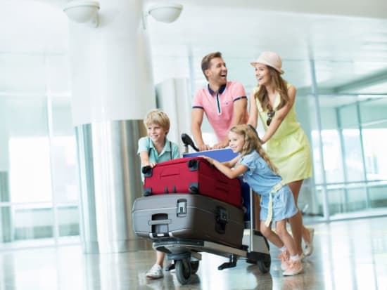 Generic_Airport_Transfer_Passenger_Family_Suitcase_Luggage_Shutterstock (1)