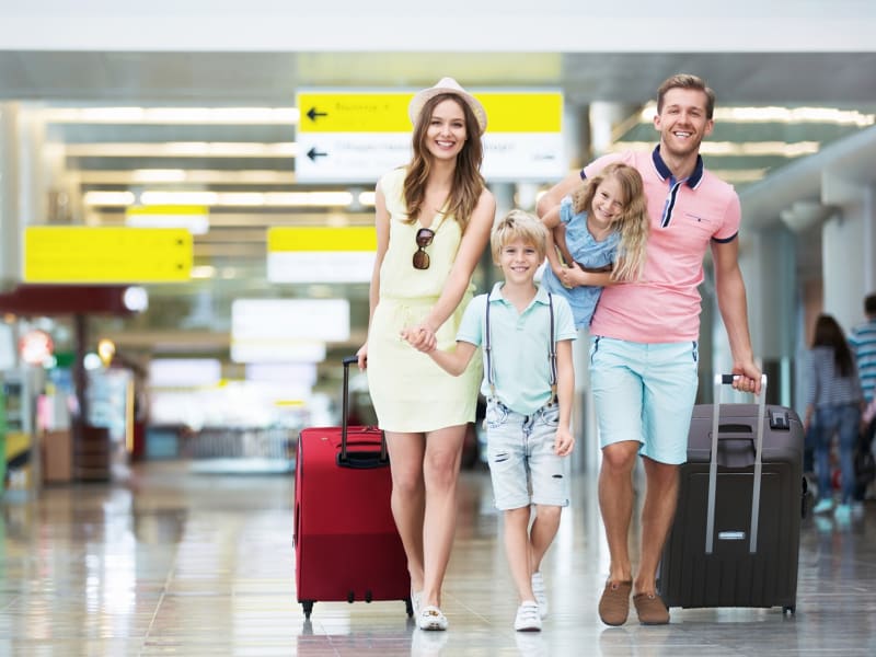 Generic_Airport_Young-Family-with-Luggage_shutterstock_326490512