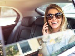 Airport Transfer Passenger on call with someone
