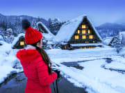 Japan_Gifu_Shirakawago_Winter_Woman_shutterstock_1027455106