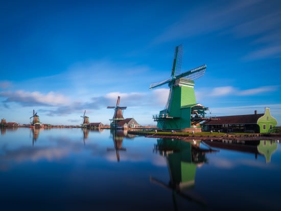 Netherlands_Zaanse Schans_windmill_canal_shutterstock_1090673390