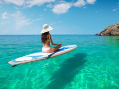 Hawaii_woman_SUP_standup paddleboarding_shutterstock_519991699