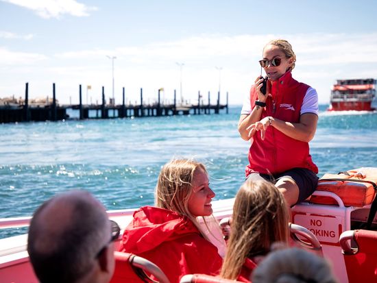 REX-Adventure Boat-Eco boat-Tour host explaining to guests_1920