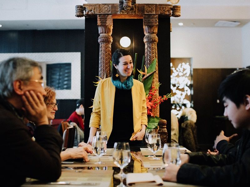 Dacia Pierson. Flatiron Food Tour. Avital at Junoon looking at guests