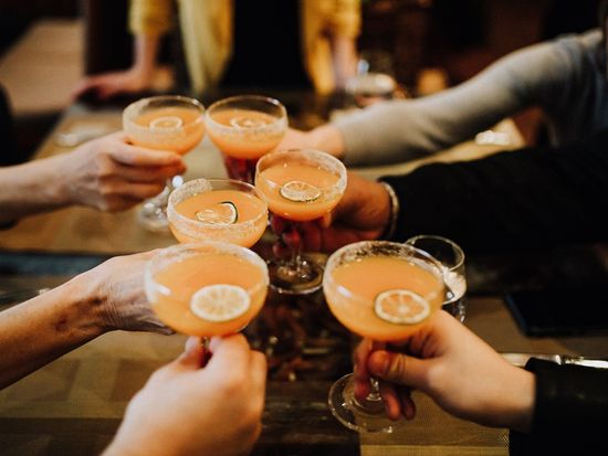 Dacia Pierson. Flatiron Food Tour. Guests cheersing with cocktails at Junoon