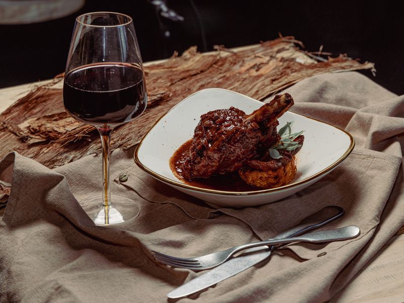 Braised wallaby shanks, native infused tomatoes, sweet potato rosti w wine glass (photo credit Yazzen Omar)
