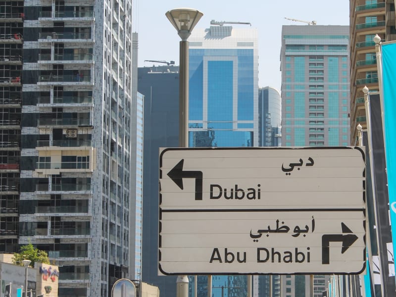 Generic_Airport_Transfer_Dubai_Abu_Dhabi_UAE_Road_Sign_shutterstock_246347197