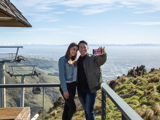 Couple taking photo with scenery