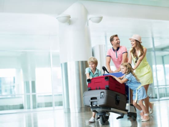 Generic_Airport_Transfer_Passenger_Family_Suitcase_Luggage_Shutterstock (1)