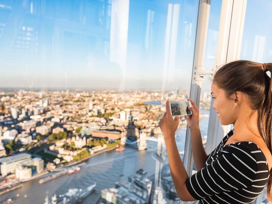 Woman photographing the view from the Shard shutterstock _2_